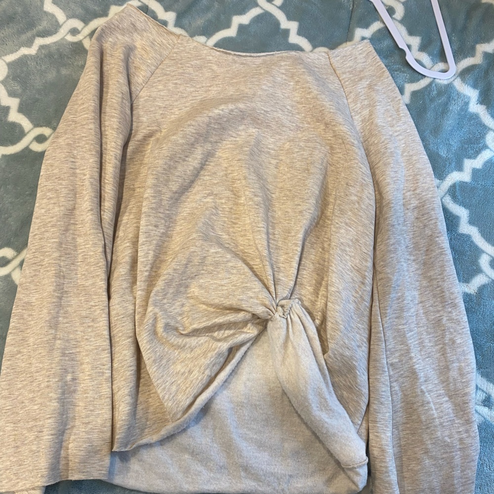 This is a soft grayish sweater, large extra large after shoulder no neck